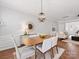 Open floorplan with wood floors that combines dining and living room at 6449 Silver Star Ln, Charlotte, NC 28210