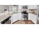 Well-lit kitchen features stainless appliances, granite counters, and lots of storage at 6449 Silver Star Ln, Charlotte, NC 28210