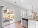 Open kitchen with stainless steel appliances and access to a patio and backyard at 6449 Silver Star Ln, Charlotte, NC 28210