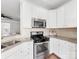 The kitchen features white cabinets, stainless steel appliances, and granite counters at 6449 Silver Star Ln, Charlotte, NC 28210