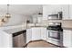 Kitchen features stainless steel appliances, granite counters, and white cabinetry at 6449 Silver Star Ln, Charlotte, NC 28210