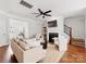 Spacious living area with a fireplace, hardwood floors, and neutral tones at 6449 Silver Star Ln, Charlotte, NC 28210