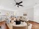 Open-concept living room flowing into the dining area with hardwood floors at 6449 Silver Star Ln, Charlotte, NC 28210