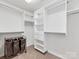 Spacious walk-in closet with custom shelving and ample storage space for organization at 6449 Silver Star Ln, Charlotte, NC 28210