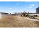 Expansive backyard with white fence, playset, patio, and ample room for outdoor enjoyment at 668 Pointe Andrews Sw Dr # 93, Concord, NC 28025