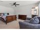 Comfortable bedroom with a ceiling fan, and ample space for a seating area and dresser at 668 Pointe Andrews Sw Dr # 93, Concord, NC 28025