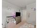 Bright bedroom featuring decor, a hamster cage and a television at 668 Pointe Andrews Sw Dr # 93, Concord, NC 28025