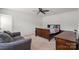Spacious bedroom with room for a bed, seating area, and a dresser with natural light from the windows at 668 Pointe Andrews Sw Dr # 93, Concord, NC 28025