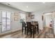 Bright dining area with a wooden table, view to backyard, and modern decor at 668 Pointe Andrews Sw Dr # 93, Concord, NC 28025