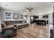 Open-concept living room and kitchen featuring hardwood floors and modern decor at 668 Pointe Andrews Sw Dr # 93, Concord, NC 28025