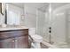 Bathroom featuring a granite countertop, glass shower, and neutral color scheme at 7035 Walnut Branch Ln, Charlotte, NC 28277