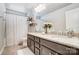 Granite counters and a shower with a curtain rod highlight this bathroom at 7035 Walnut Branch Ln, Charlotte, NC 28277