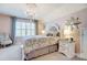 This bedroom has pink walls and a large bed at 7035 Walnut Branch Ln, Charlotte, NC 28277