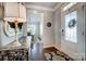 Inviting foyer with a view into the dining area, featuring elegant decor and hardwood floors at 7035 Walnut Branch Ln, Charlotte, NC 28277