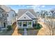 Charming single-Gathering home with a welcoming front porch, complemented by well-maintained landscaping at 7035 Walnut Branch Ln, Charlotte, NC 28277