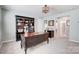 This home office has a large desk and stylish decorations at 7035 Walnut Branch Ln, Charlotte, NC 28277
