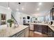 Open kitchen boasts a center island, stainless steel appliances, and seamless access to the living area at 7035 Walnut Branch Ln, Charlotte, NC 28277