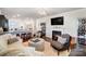 Warm and inviting living room featuring a fireplace and an open-concept kitchen at 7035 Walnut Branch Ln, Charlotte, NC 28277