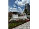 Community signage for 'The Bowl at Ballantyne' with flowerbed and tower in the background at 7035 Walnut Branch Ln, Charlotte, NC 28277