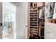 Organized walk-in closet with built-in shoe racks and plenty of hanging space at 7035 Walnut Branch Ln, Charlotte, NC 28277