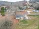 Aerial view of a home with a fenced-in backyard on a residential street at 709 High St, Albemarle, NC 28001