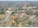 Aerial view of a residential neighborhood with houses and bare trees in the winter at 709 High St, Albemarle, NC 28001