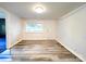 Spacious basement featuring new flooring, a window, and a door to the outside at 709 High St, Albemarle, NC 28001