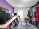 Spacious walk-in closet with ample storage, built-in shelving, and lots of clothes at 709 High St, Albemarle, NC 28001