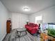 Simple living room with plank flooring and window with views at 709 High St, Albemarle, NC 28001