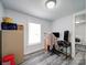 Small office space with plank flooring, a window, and bright lighting at 709 High St, Albemarle, NC 28001