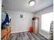 Small storage room with plank flooring and storage solutions at 709 High St, Albemarle, NC 28001