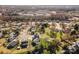 Scenic aerial view of a suburban neighborhood showcasing tree-lined streets, well-kept homes, and green spaces in a peaceful setting at 7102 Lanark Ct, Charlotte, NC 28217