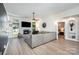 Spacious living room featuring a fireplace, large windows, and cozy seating area at 7102 Lanark Ct, Charlotte, NC 28217