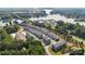 Aerial view of modern townhomes and a serene lake creates a peaceful and inviting community setting at 7113 Brookview Ln, Sherrills Ford, NC 28673