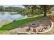 A lakeside community features a fire pit with chairs, perfect for gatherings, and enjoying the beautiful waterfront views at 7113 Brookview Ln, Sherrills Ford, NC 28673