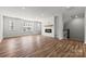 Bright living room featuring a fireplace, large windows, and hardwood floors, creating a comfortable and stylish space at 7113 Brookview Ln, Sherrills Ford, NC 28673
