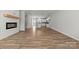 Stylish living room with a fireplace, hardwood floors, and a glimpse of the modern kitchen, perfect for entertaining at 7113 Brookview Ln, Sherrills Ford, NC 28673