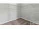 Walk-in closet with shelves and neutral carpeting at 7113 Brookview Ln, Sherrills Ford, NC 28673