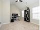 Bright bedroom with vaulted ceiling, large windows, desk, and closet space at 7220 Hidden Creek Dr, Charlotte, NC 28214