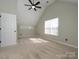 Bedroom with ceiling fan, carpet, and lots of natural light at 7220 Hidden Creek Dr, Charlotte, NC 28214