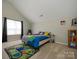 Fun bedroom with whimsical decor and bright colors at 7220 Hidden Creek Dr, Charlotte, NC 28214