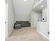 Cozy bonus room featuring neutral paint, carpet, and a comfortable sofa at 7220 Hidden Creek Dr, Charlotte, NC 28214
