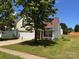 Charming two-story home features a well-manicured lawn, attached garage and beautiful front yard landscaping at 7220 Hidden Creek Dr, Charlotte, NC 28214