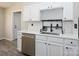Updated kitchen featuring stainless steel appliances, white cabinetry and countertops and a stainless steel dishwasher at 7220 Hidden Creek Dr, Charlotte, NC 28214