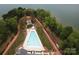 Drone view showcasing a community pool, lush landscaping, and a gazebo against a serene lake backdrop at 7441 Fighting Creek Rd # 30, Sherrills Ford, NC 28673