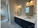 Elegant bathroom featuring double sinks, quartz countertops, and modern lighting at 7441 Fighting Creek Rd # 30, Sherrills Ford, NC 28673