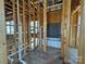 Bathroom in progress showcasing frame, plumbing, and tub, displaying the rough layout and fixture placement at 7441 Fighting Creek Rd # 30, Sherrills Ford, NC 28673