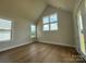 Bright bedroom with ample natural light, featuring hardwood floors and large windows at 7441 Fighting Creek Rd # 30, Sherrills Ford, NC 28673