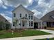 Beautiful two-story home with a well-manicured lawn and inviting front porch at 7441 Fighting Creek Rd # 30, Sherrills Ford, NC 28673