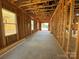 View of the garage in mid construction with a smooth concrete floor, ready for customization at 7441 Fighting Creek Rd # 30, Sherrills Ford, NC 28673